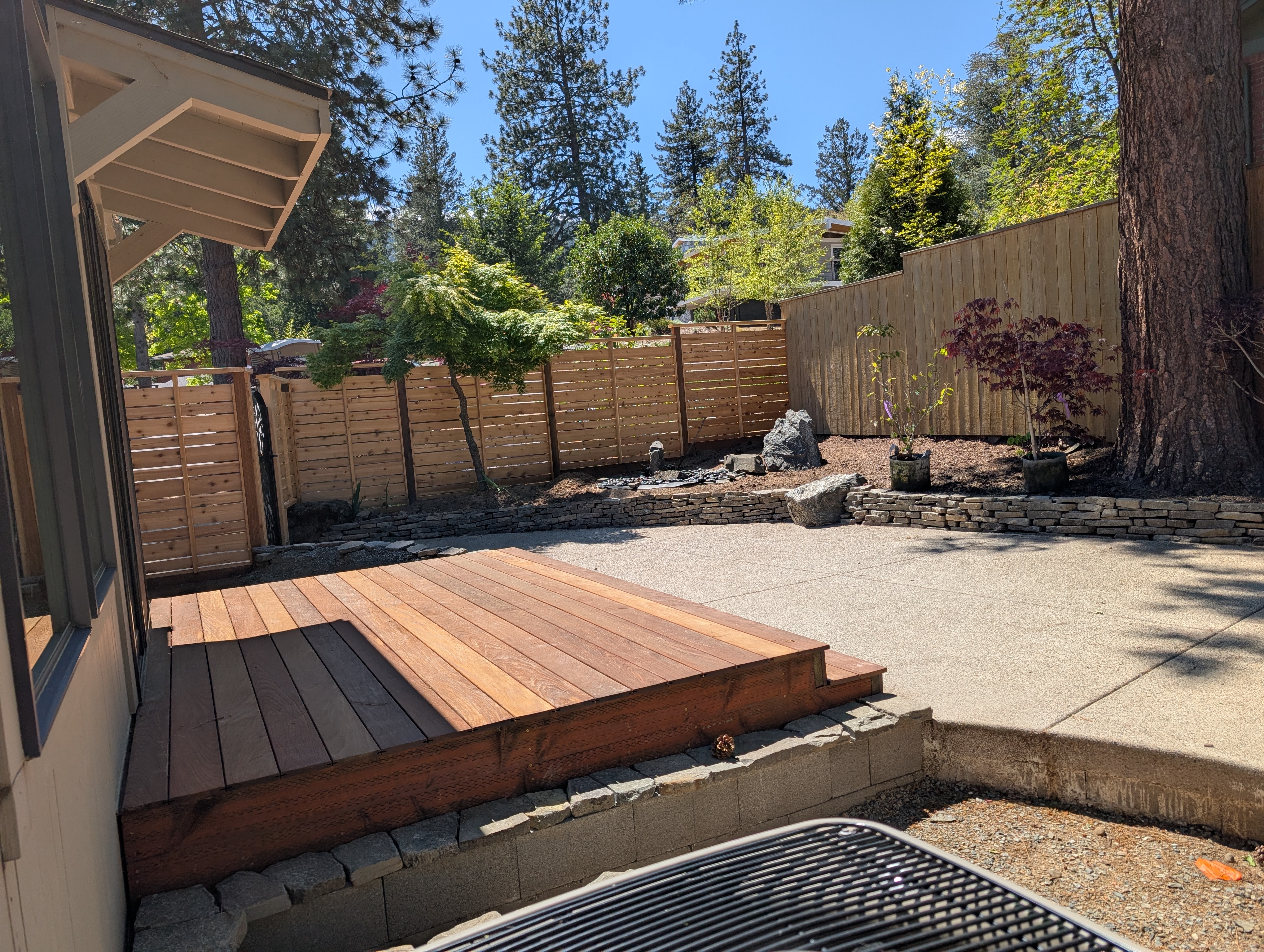 Completed backyard with fence wrapping the full perimeter